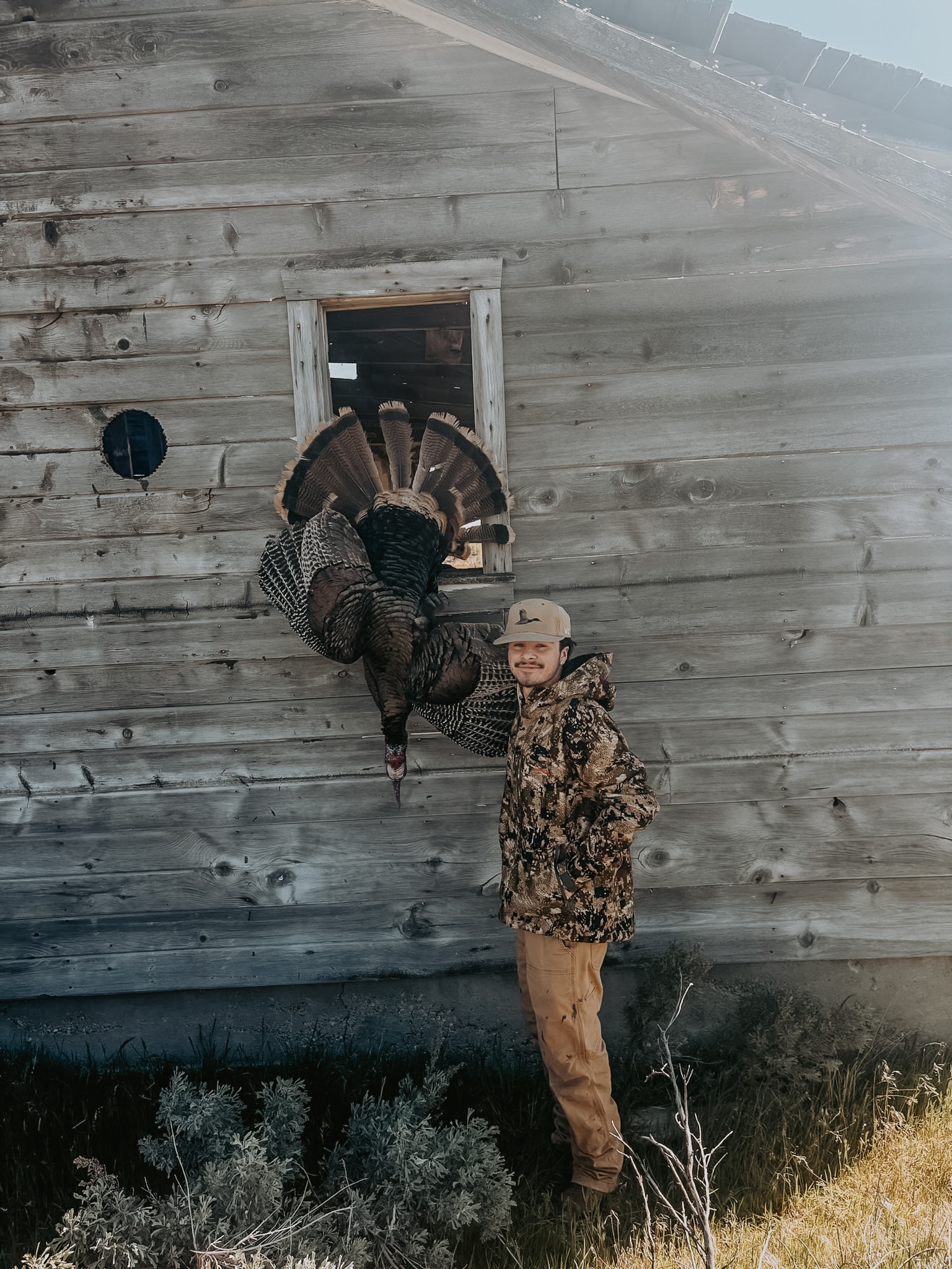 Hunters walking through morning fog